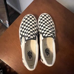 Checkered Vans slip ons